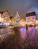Typical houses enriched by Christmas ornaments and lights at dusk Colmar Haut-Rhin department Alsace France Europe