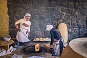 Traditional way of baking bread in the tandoor, Armenia, Caucaus, Eurasia