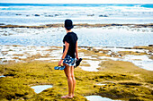 Young woman traveling at ocean coastline