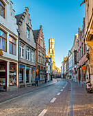 Photograph of shopping street with Belfry of Bruges, Bruges, West Flanders, Belgium