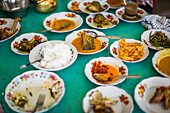Traditional food, padang, at a restaurant in Kerinci Valley, Indonesia.