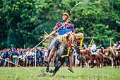 Man with spear participating in Pasola Festival, Sumba island, Indonesia