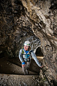 High Angle View Of Woman Hiking Through The Tunnel