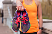 Close-up Of Person Showing Colorful Shoes