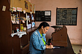 A Government-run old-style shop with few items and old cash register