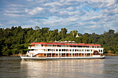 Ayeyarwady (Irrawaddy) river cruise ship Anawrahta (Heritage Line) and pagodas, near Shwegu, Kachin, Myanmar