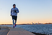 Man is running along the coast