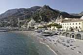 Italy, Amalfi Coast, Landscpae, Panorama, Amalfi's shingle beach. Amalfi is a small town whose high white houses are perched on the slopes of the hills in front of a deep blue sea.