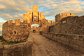 Liberty Gate at sunset, Medieval Old Rhodes Town, UNESCO World Heritage Site, Rhodes, Dodecanese, Greek Islands, Greece, Europe