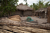 A traditional mud hut home with a thatched roof and a solar panel on the top of it, Tanzania, East Africa, Africa