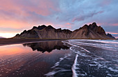 View of the mountains of Vestrahorn from black volcanic sand beach at sunset, Stokksnes, South Iceland, Polar Regions