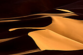 Shapes and shadows in dunes of the Erg Chebbi sand sea, part of the Sahara Desert near Merzouga, Morocco, North Africa, Africa