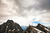 Photograph of mountaineer in scenery of North Cascade Mountain Range, Chilliwack, British Columbia, Canada
