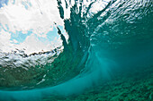 A wave is seen breaking from underwater on a section of Glover's Reef, Belize.