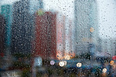 Photograph of out of focus buildings in city behind window during rain, Los Angeles, California