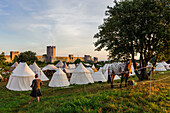 City wall of the old town of Visby, tent camp Medieval festival in front of the old city wall, Schweden