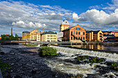 Motala Stroem with waterfalls flowing through the former industrial landscape Norrkoepings, Sweden