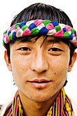 Asian man wearing multicolor headband