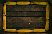 Corn on cob lining wooden box