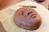 Clay mask in art studio
