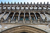 Rows of gargoyles adorn the facade of Eglise Notre Dame cathedral, Dijon, Côte-d'Or, Bourgogne-Franche-Comté, France