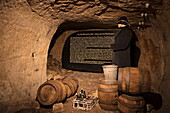 'Historic barrels and history of ''Der Alte Fritz'' on display in underground Katakomben catacomb tunnel system of Bayreuther Bierbrauerei AG, Bayreuth, Franconia, Bavaria, Germany'