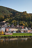 View across Main river to town and Burg Freudenberg castle in autumn, Freudenberg, near Miltenberg, Spessart-Mainland, Franconia, Bavaria, Germany
