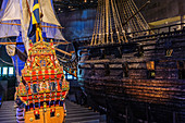 Model of the Vasa next to the original in the Vasa Museum, Stockholm, Sweden