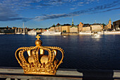 View from the Skeppsholmsbron with crown on the railing on the old town, Stockholm, Sweden