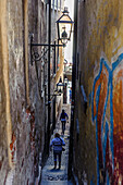 Tourists in very narrow street in the old town Gamla Stan, Stockholm, Sweden