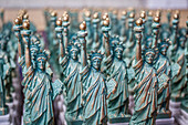 small replicas of the statue of liberty on sale in the souvenir shop on liberty island, new york harbor, new york city, state of new york, united states, usa
