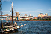 view of the brooklyn bridge and brooklyn from the riverside in the financial district of manhattan, brooklyn, new york city, state of new york, united states, usa