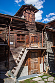 typical old houses in the center of the village of zermatt, ski resort, zermatt, canton of valais, switzerland