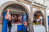 butcher's shop in the jedid souk and the porters on istiqlal avenue in the centre of the medina, essaouira, mogador, atlantic ocean, morocco, africa