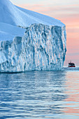 tourist sightseeing boat in the middle of the icebergs in the ice fjord, jakobshavn glacier, 65 kilometres long, coming from the inlandsis, sermeq kujalleq, ilulissat, greenland