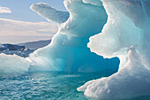 icebergs that separated from the glacier snouts, strangely shaped block of ice, fjord of narsaq bay, greenland