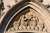 sculpture in the tympanum with two angels holding the coat of arms of france, belfry of the 15th century clock tower, place du general de gaulle, evreux (27), france