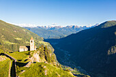 Ancient church perched on mountains, San Romerio Alp, Brusio, Canton of Graubunden, Poschiavo Valley, Switzerland, Europe