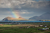 Rainbow over hills and dwellings, looking towards Clogher and Rosroe, Dingle Peninsula, County Kerry, Munster, Republic of Ireland, Europe