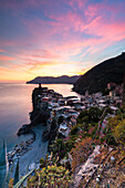 A stunning sunset over the old town and harbour of Vernazza, Cinque Terre, UNESCO World Heritage Site, Liguria, Italy, Europe
