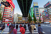 Neon signs cover buildings in the consumer electronics district of Akihabara, Tokyo, Japan, Asia