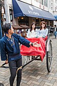 Japan, Honshu, Tokyo, Asakusa, Girls in Rickshaw