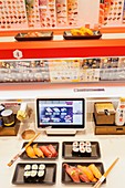 Japan, Honshu, Tokyo, Sushi Restaurant, Touch Screen Conveyor Belt Ordering System