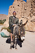 Donkey used as a means of transportation, Garmeh oasis, Iran