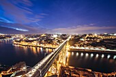 Evening in Porto city, Portugal, Aerial view from Serra do Pilar viewpoint in Vila Nova de Gaia city with Dom Luis I Bridge over Douro River
