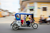 Panned shot of mototaxi in Iquitos, Peru, South America