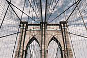 Low angle view of steel cables on Brooklyn Bridge against sky, New York City, New York, USA