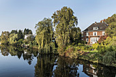 Red brick house along the Alster canal in Hamburg, Hamburg, north Germany, Germany