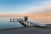 sea fog in the morning at lake Ammersee, Herrsching, Bavaria, Germany
