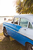 Oldtimer, old car on the beach of Playa Larga, family travel to Cuba, parental leave, holiday, time-out, adventure, Playa Larga, bay of pigs, Cuba, Caribbean island